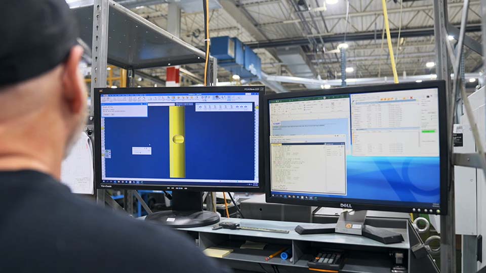 Leroy Gerving, technical support specialist, runs a GibbsCAM tooling macro that automates consistent quality results.